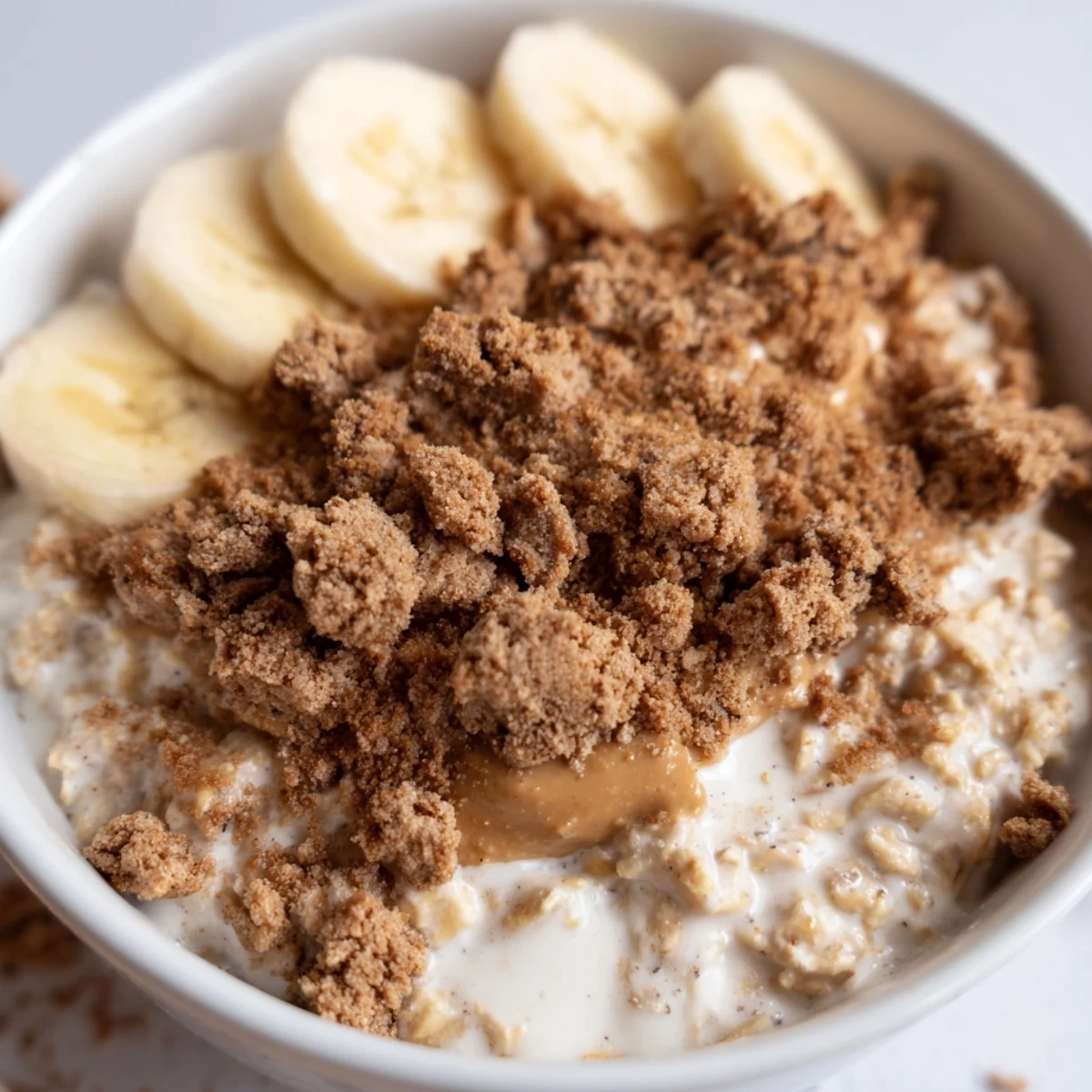Wake up to this Quick Biscoff Overnight Oats, layered in a jar with oats, yogurt, and cookie crumbles for a perfect morning.