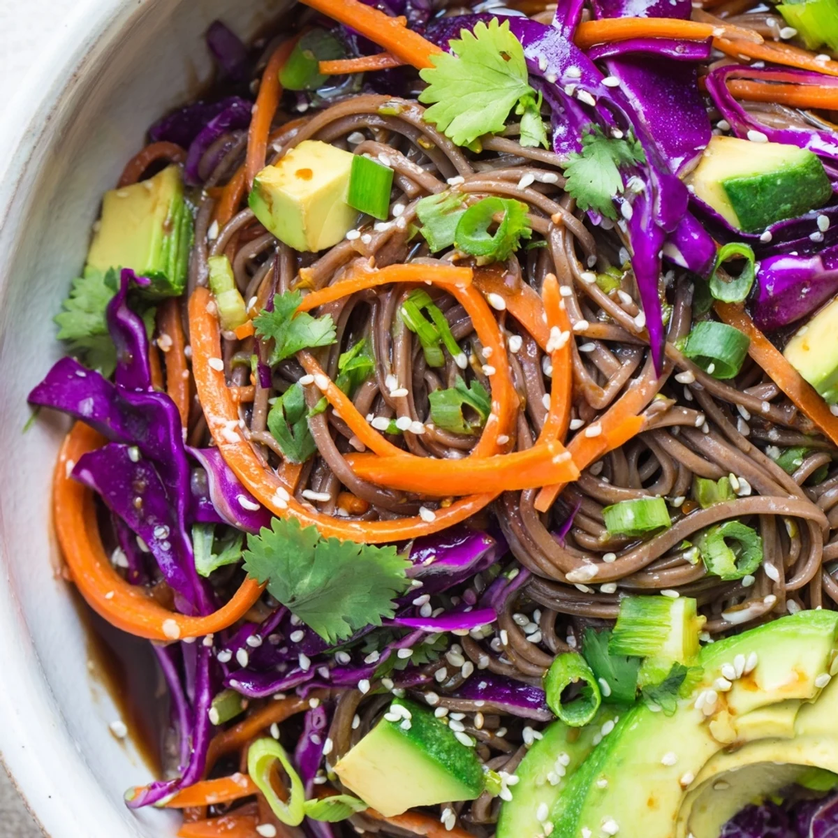 Light and refreshing Sesame Avocado and Soba Noodle Salad served in a bowl, perfect for a quick vegan lunch or healthy side dish.