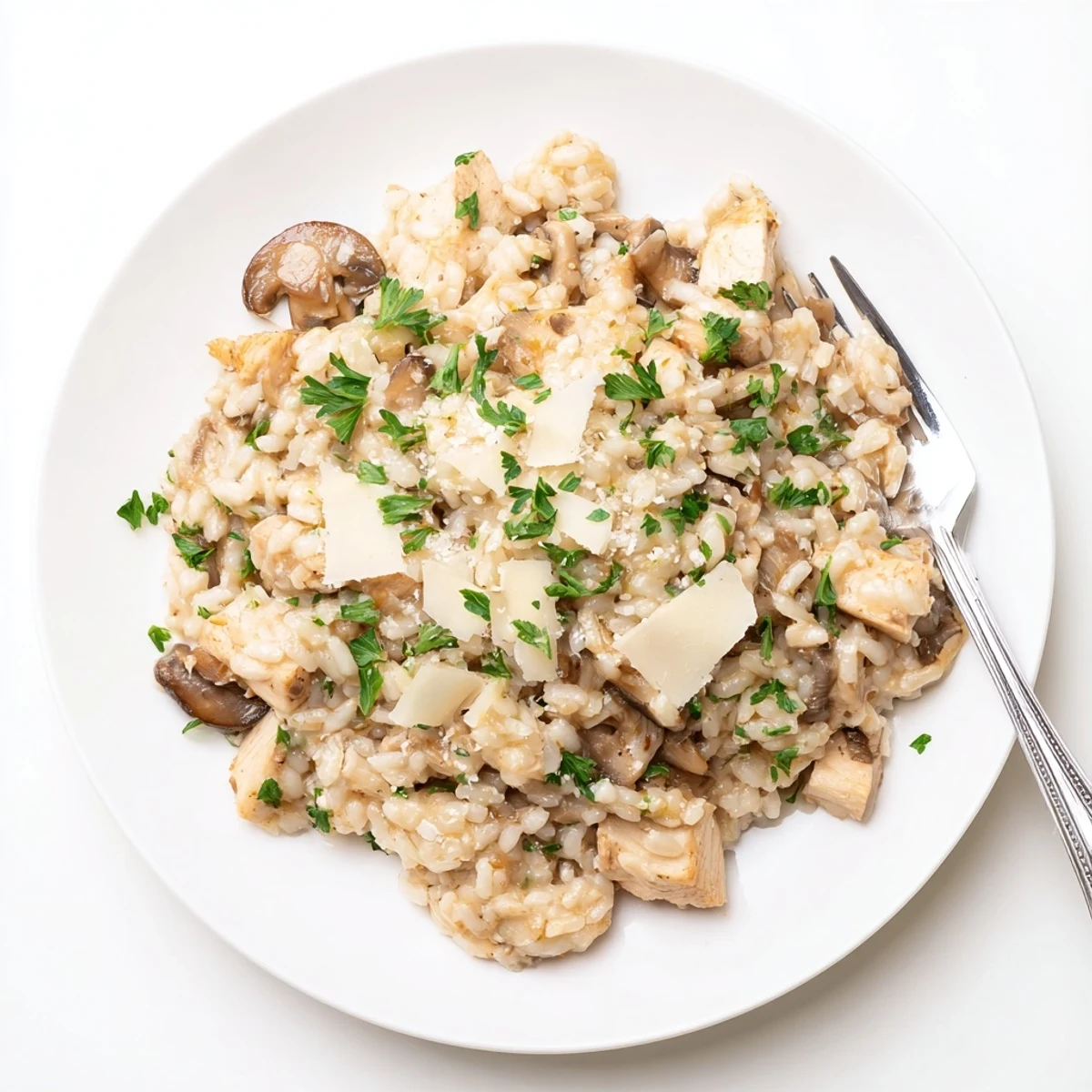 Creamy oven-baked chicken and mushroom risotto with tender diced chicken and sliced cremini mushrooms