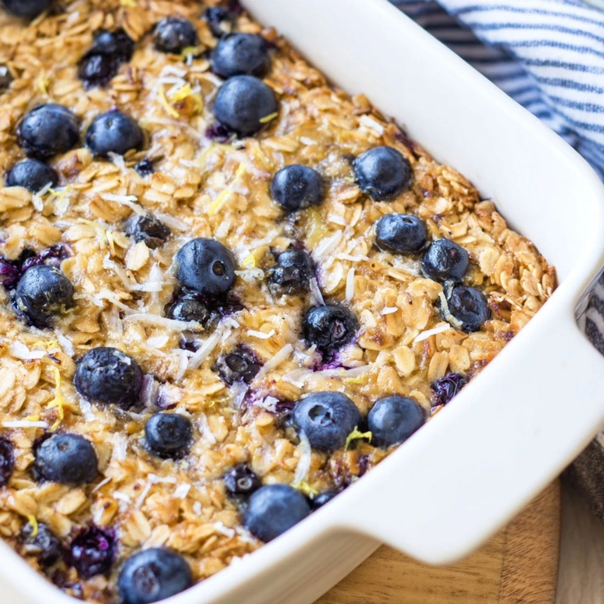 Warm lemon blueberry baked oatmeal served with a golden brown sugar crust