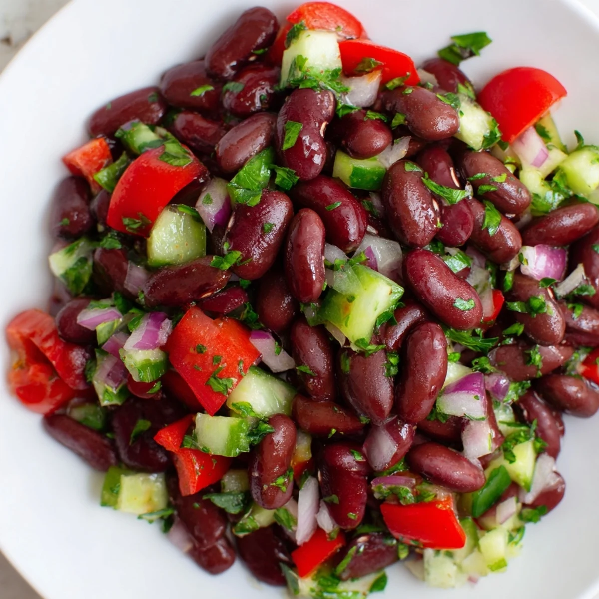 Colorful kidney bean salad tossed with crisp vegetables in a tangy vinaigrette dressing