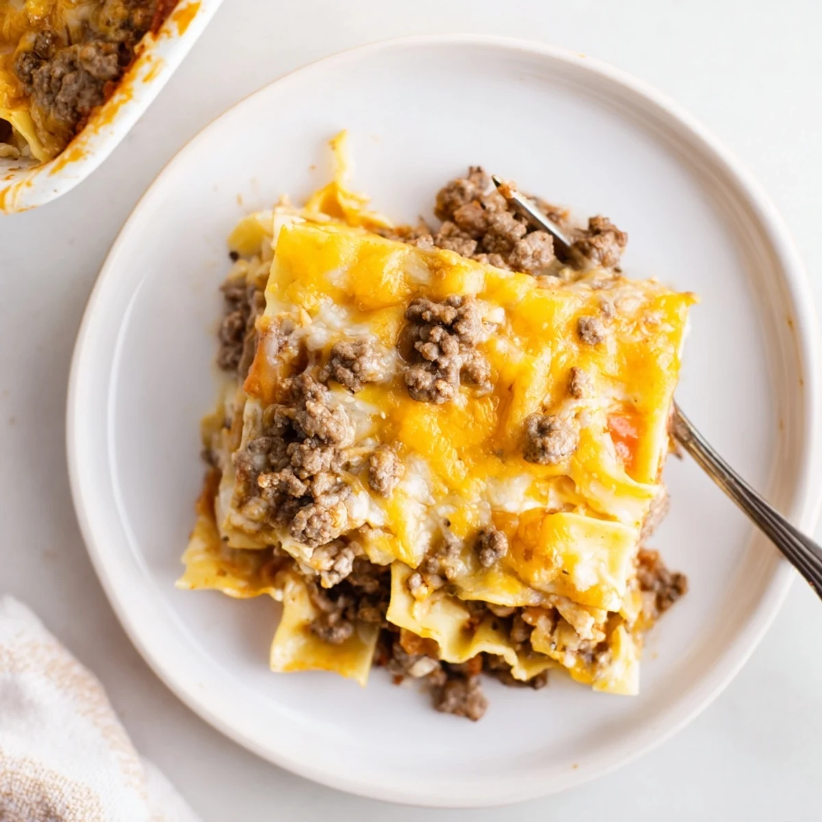 Sliced Beef Lombardi Casserole reveals creamy cottage cheese, tender egg noodles