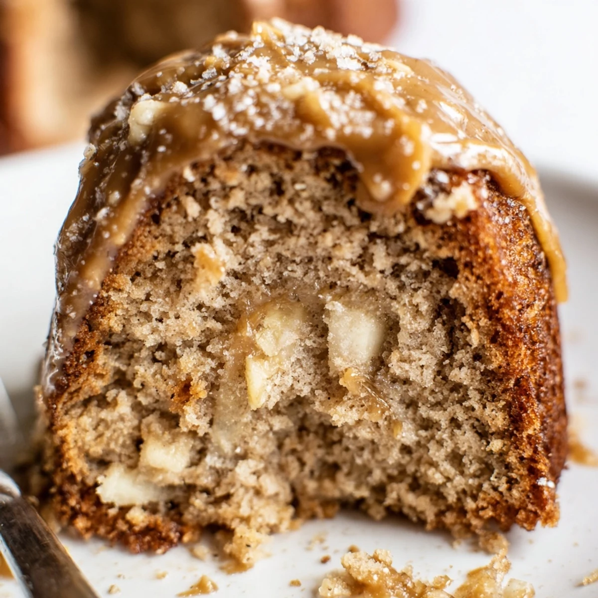 Slice of Salted Caramel Brown Butter Banana Cake on plate, nutty aroma