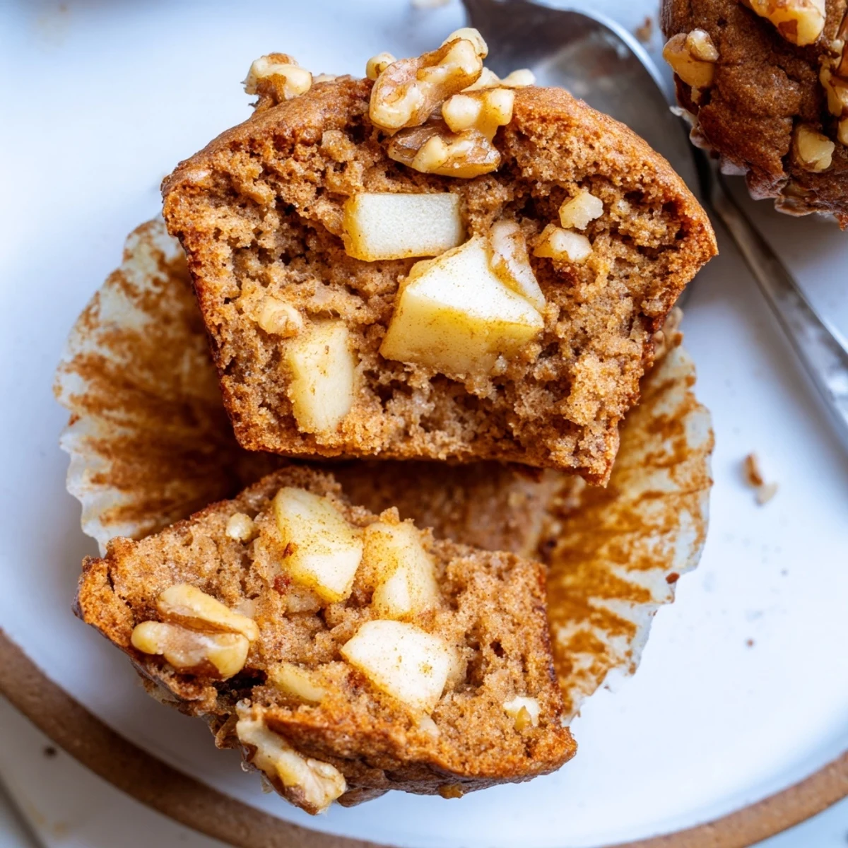 Breakfast ready Healthy Apple Cinnamon Greek Yogurt Muffins topped with chopped pecans