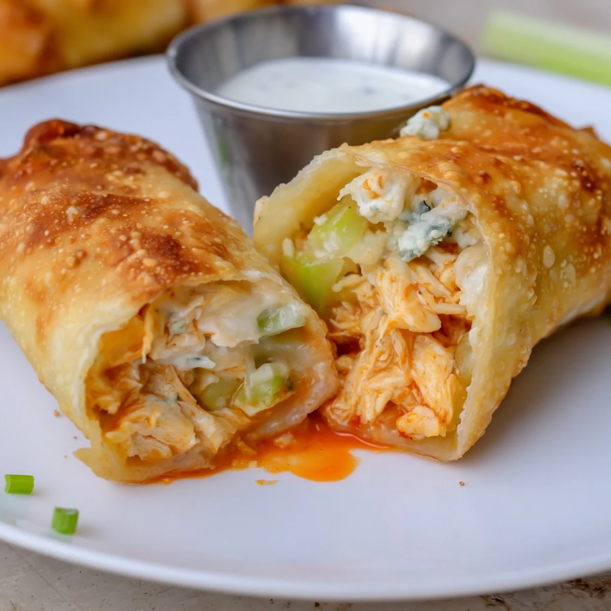 Crispy Buffalo Chicken Egg Rolls with melted mozzarella, served with ranch dip