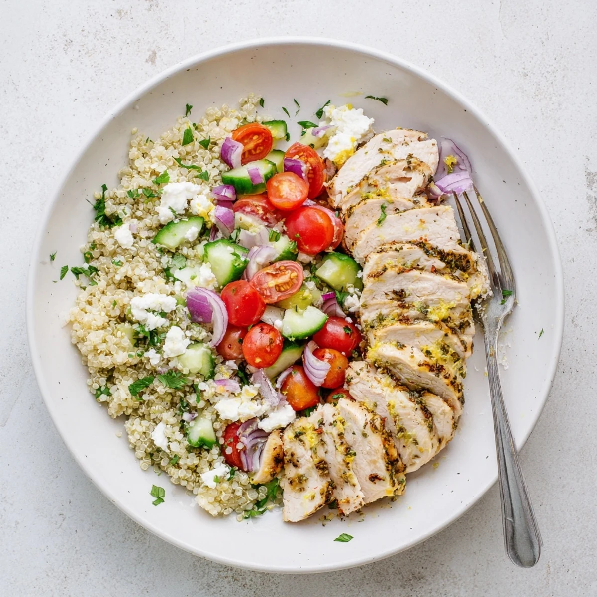 Grilled Lemon Herb Chicken And Quinoa Salad with juicy slices, tangy dressing