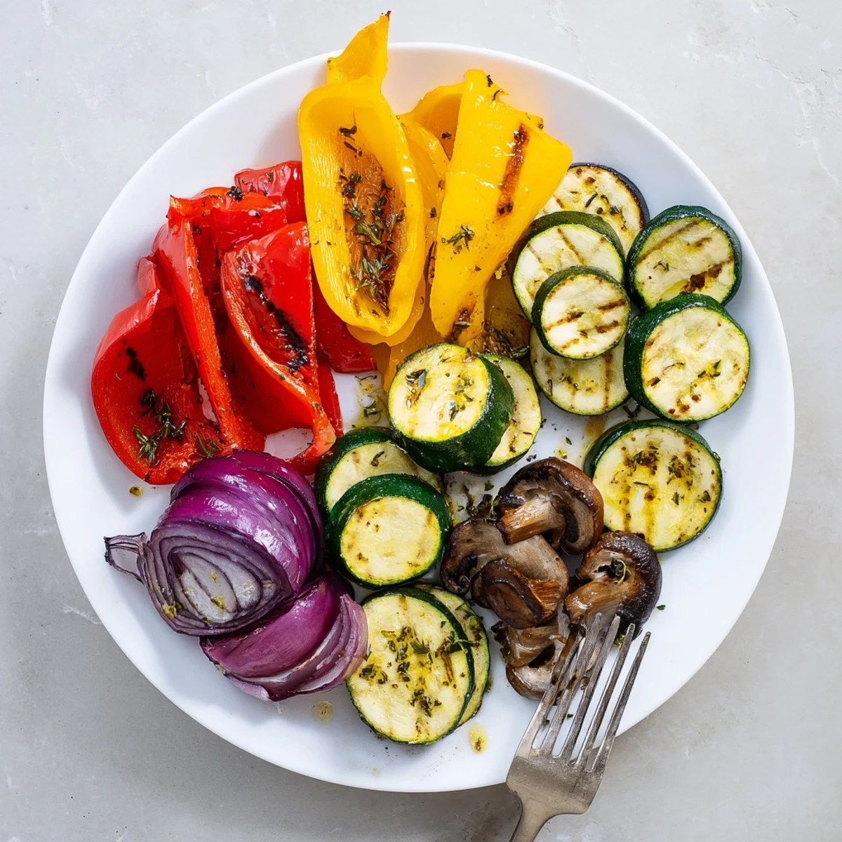 Grilled Vegetables with charred edges, fragrant herbs, ready to serve warm