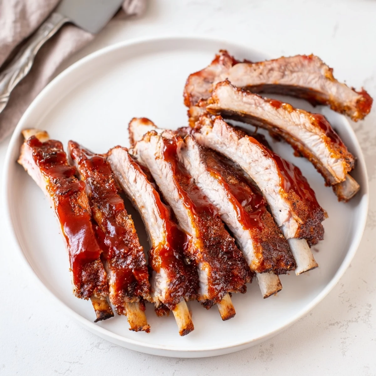 Grilled Ribs glazed with sticky barbecue sauce, charred edges and juicy inside