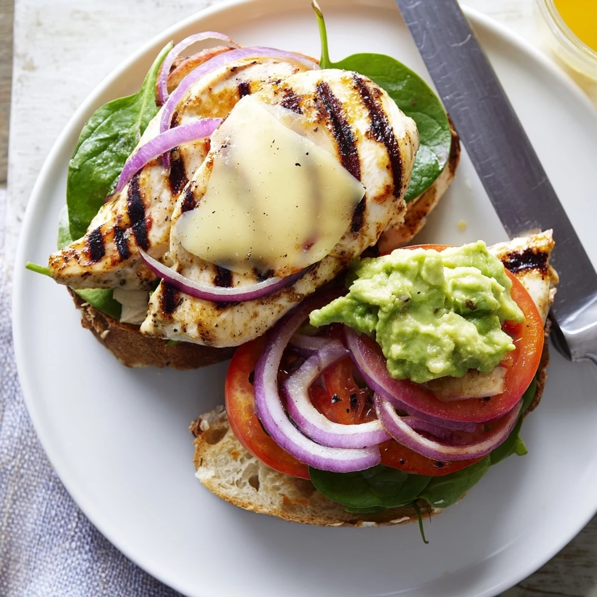 Juicy charred chicken, creamy avocado top a Grilled Chicken Avocado Sandwich Recipe with tomato