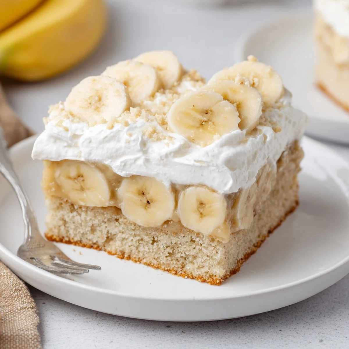 Rich Banana Pudding Cake Recipe chilled, creamy pudding layers and crunchy wafer topping