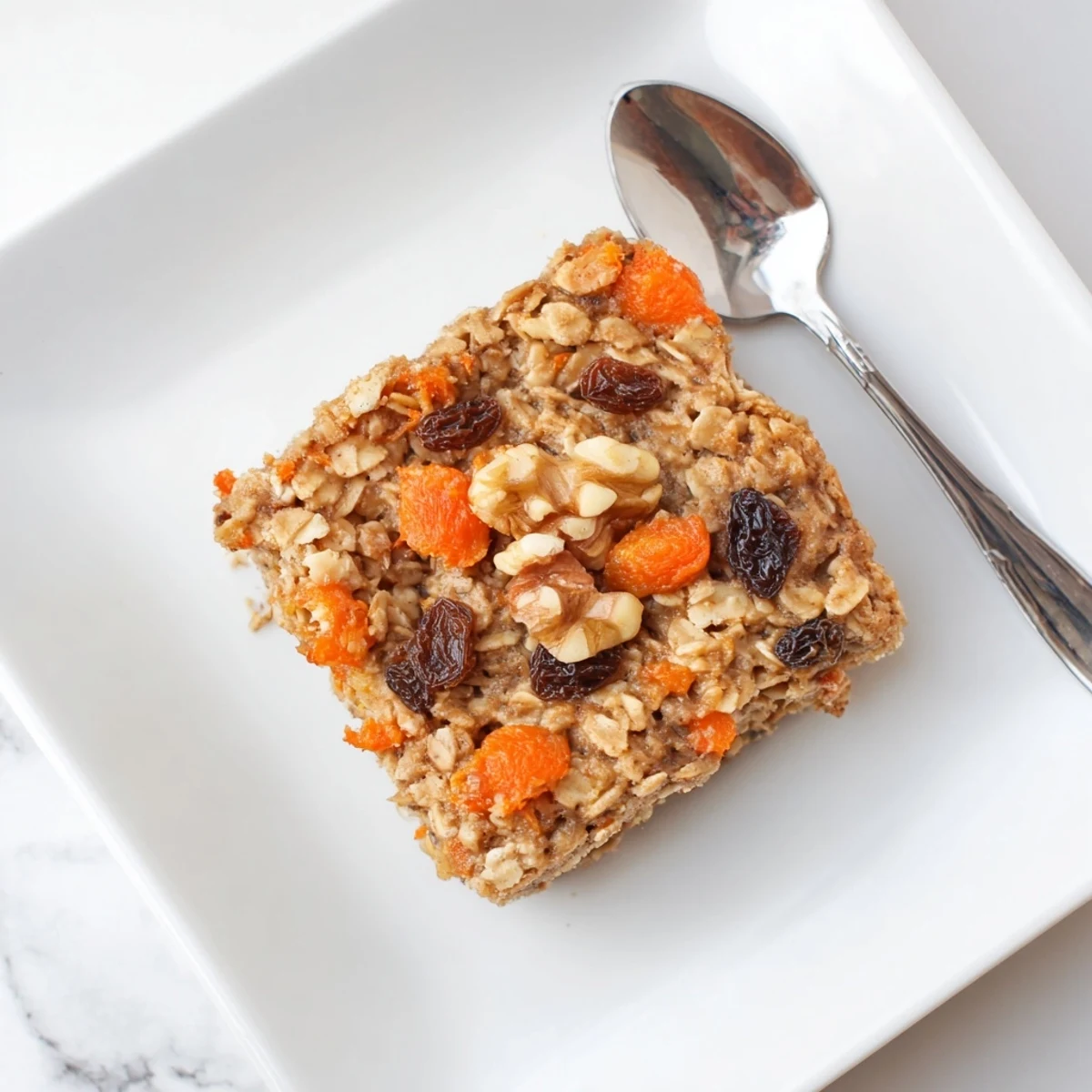 Hearty baked oatmeal with grated carrots and cinnamon resembling classic carrot cake, perfect for brunch