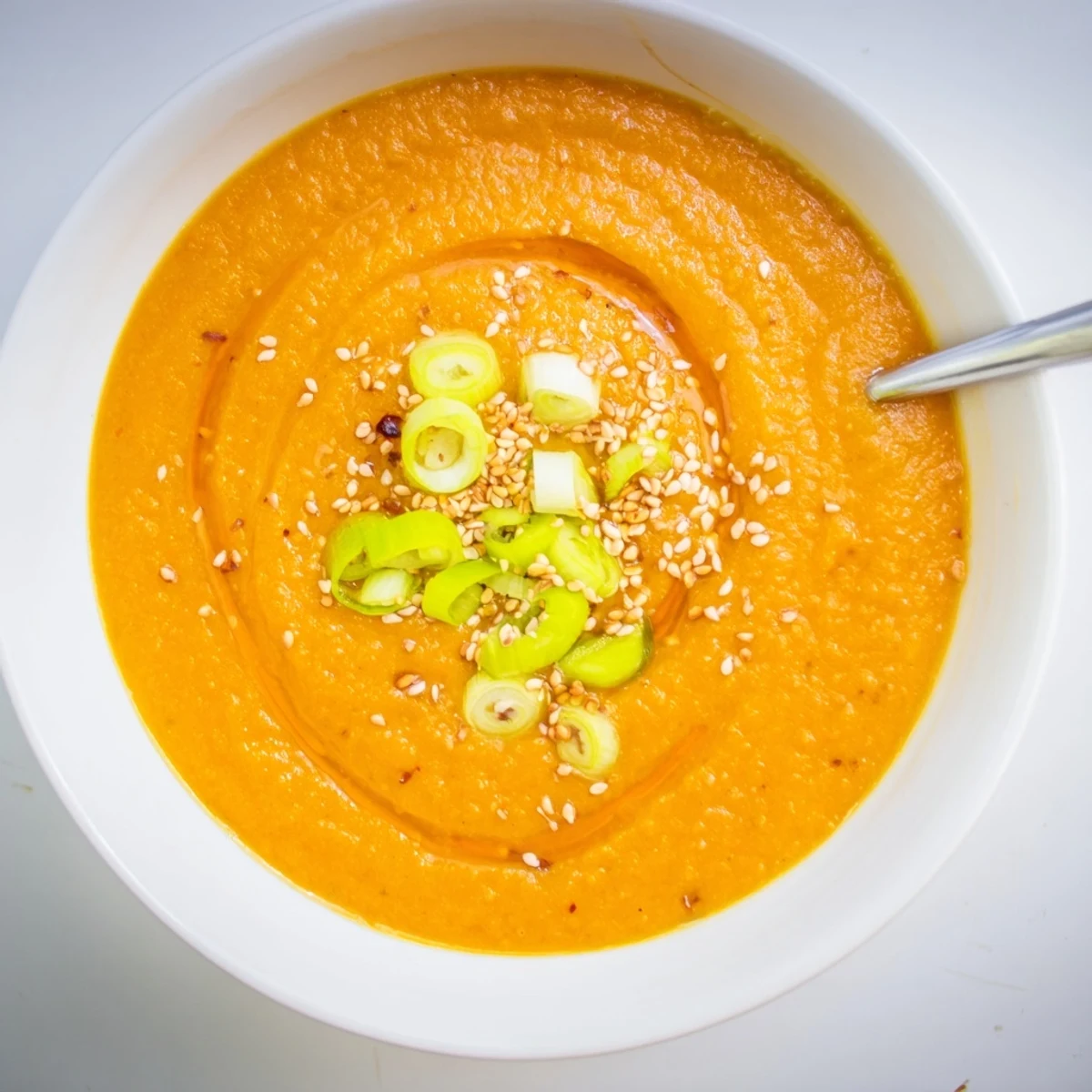 Carrot Ginger Miso Soup Recipe in bowls, velvety orange puree garnished with scallions.