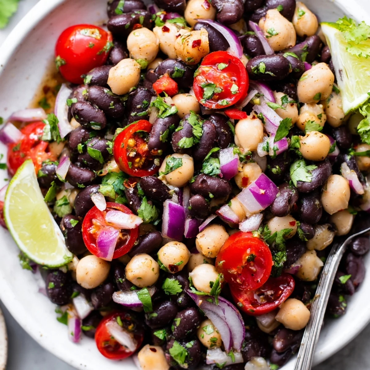 Marinated Cilantro Lime Bean Salad glistening with zesty dressing and colorful peppers