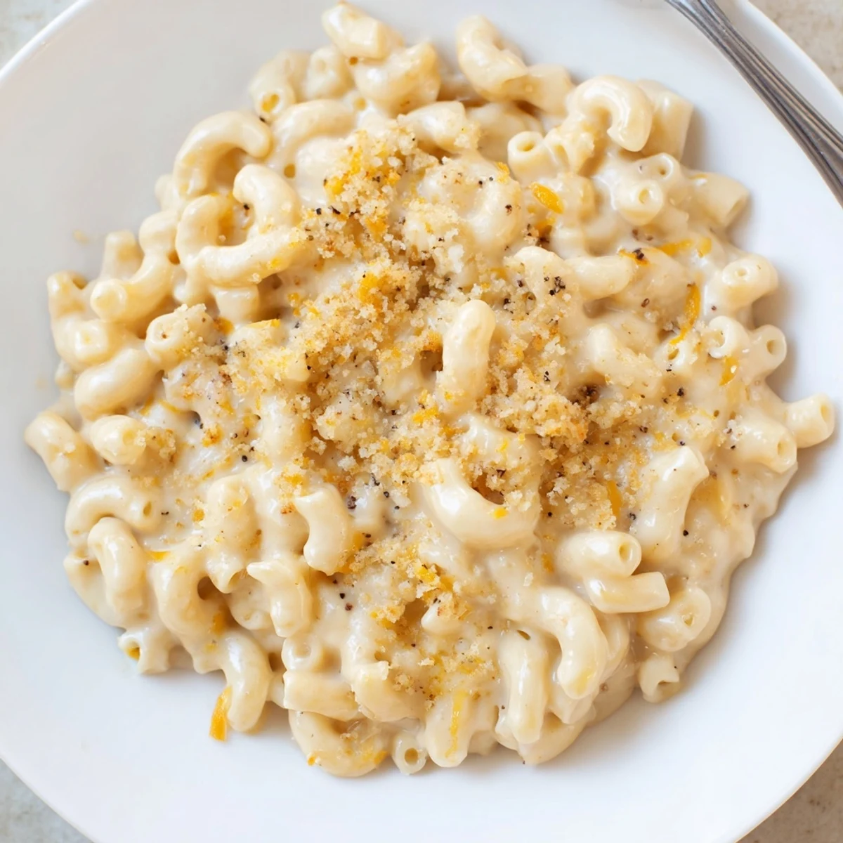Velvety Mac And Cheese spooned into bowls, steaming, sharp cheddar notes.