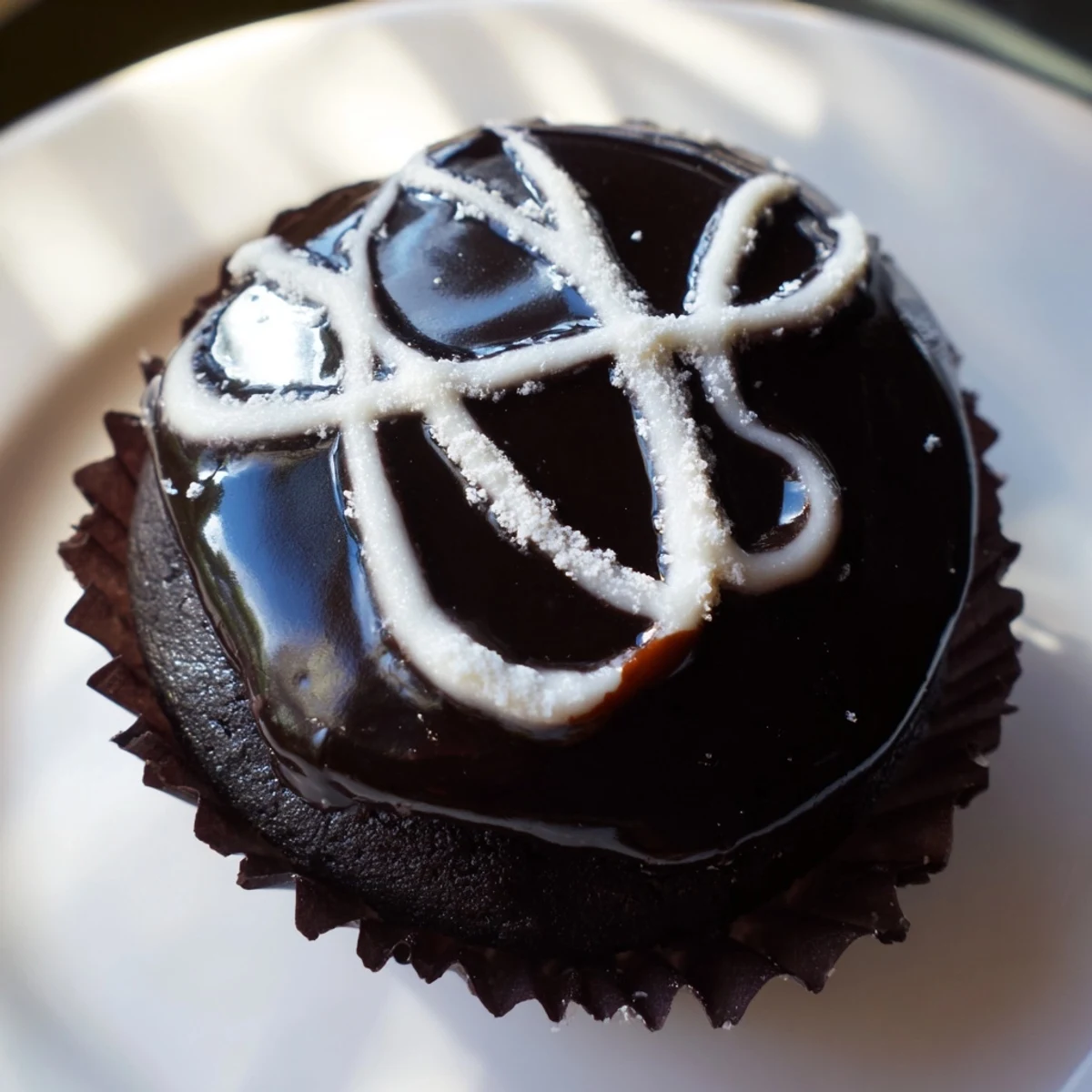 Homemade Hostess Cupcakes arranged on a platter with creamy centers and chocolate glaze