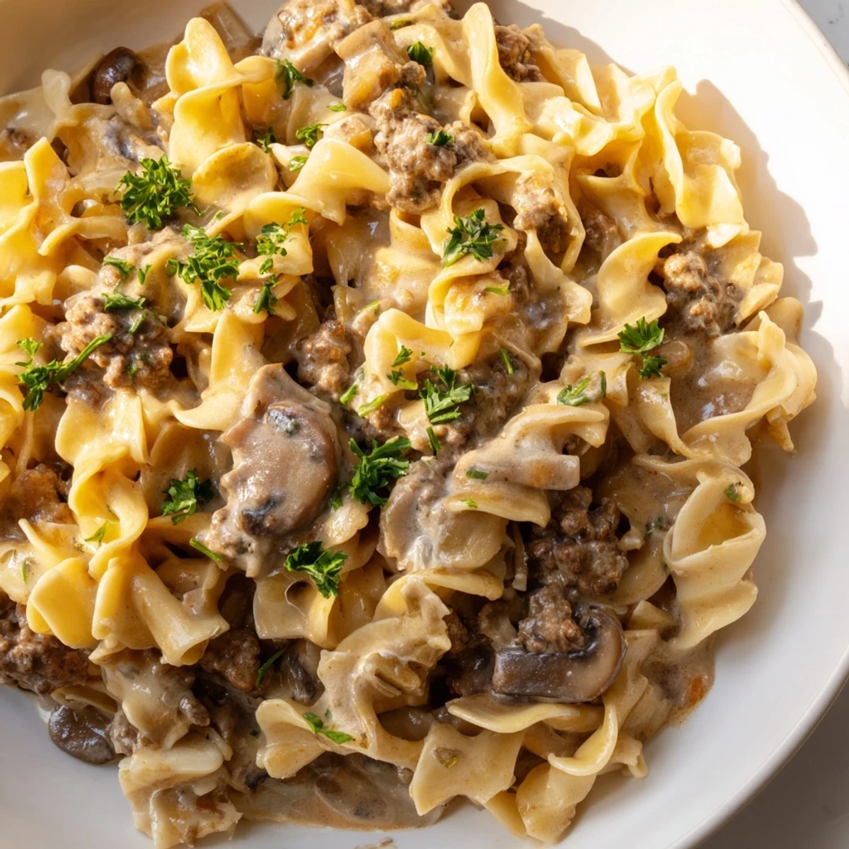 Golden seared ground beef and mushrooms in this Hearty Hamburger Stroganoff recipe