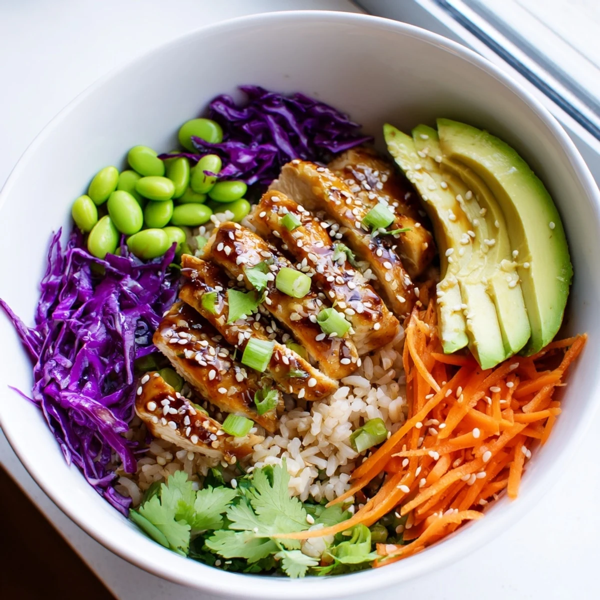 Asian Inspired Chicken Power Bowl with colorful crisp vegetables drizzled in sesame-ginger dressing