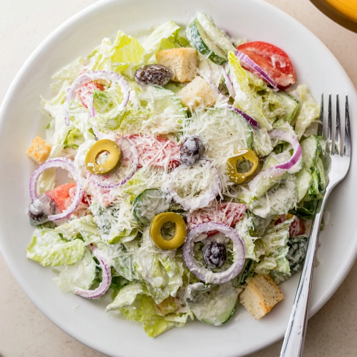 Fresh Olive Garden Salad featuring romaine lettuce, ripe tomatoes, and tangy Italian vinaigrette