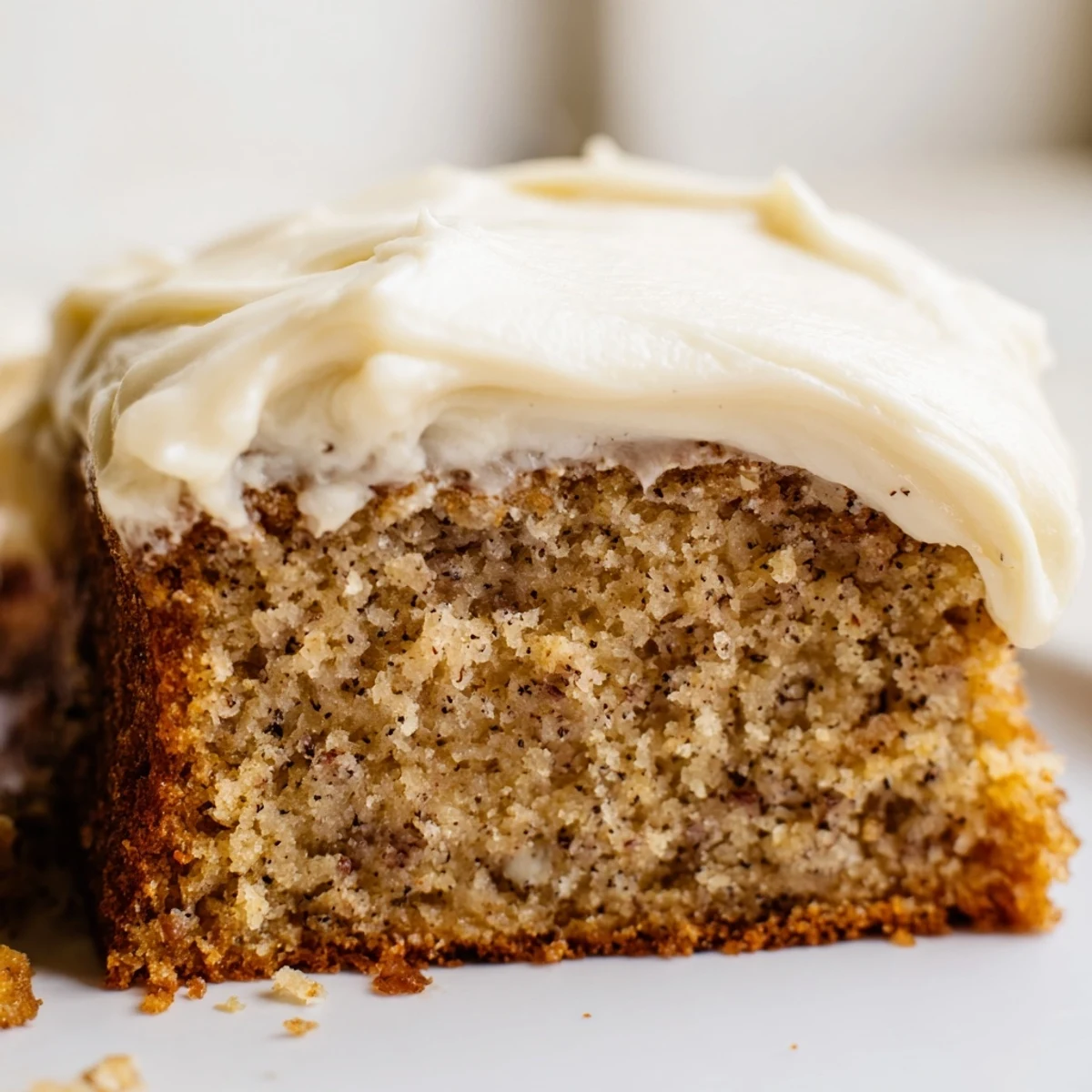 Brown butter banana cake topped with generous swirls of fluffy cream cheese frosting