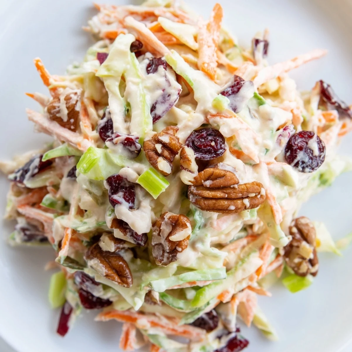 Fresh Cranberry Apple Coleslaw with crunchy cabbage, sweet apples, and tart cranberries.  