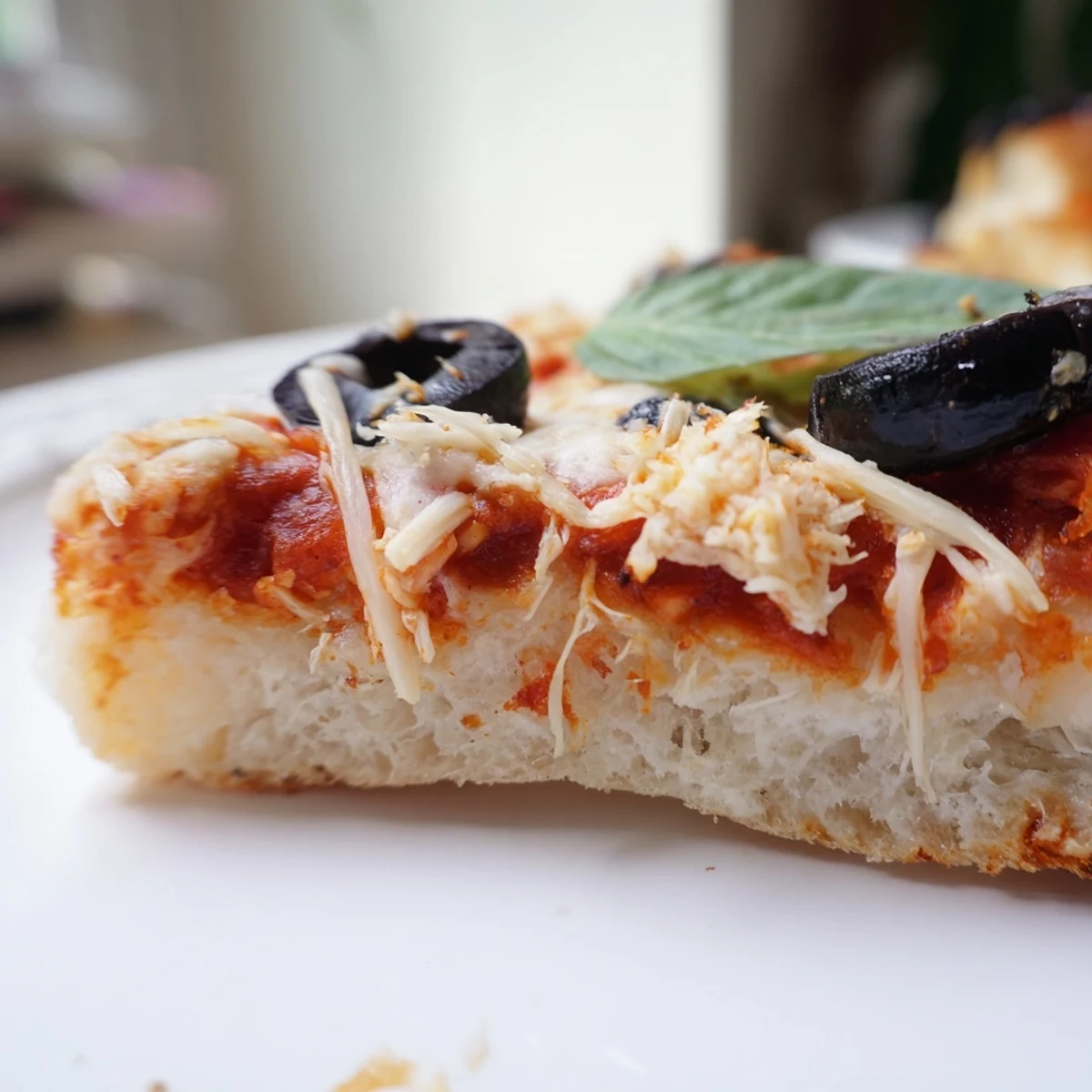 Delicious homemade pizza sliced hot, featuring a golden crust and rich tomato sauce.