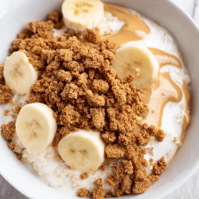 This Quick Biscoff Overnight Oats recipe features a creamy, spiced flavor with optional berries and a drizzle of melted spread.